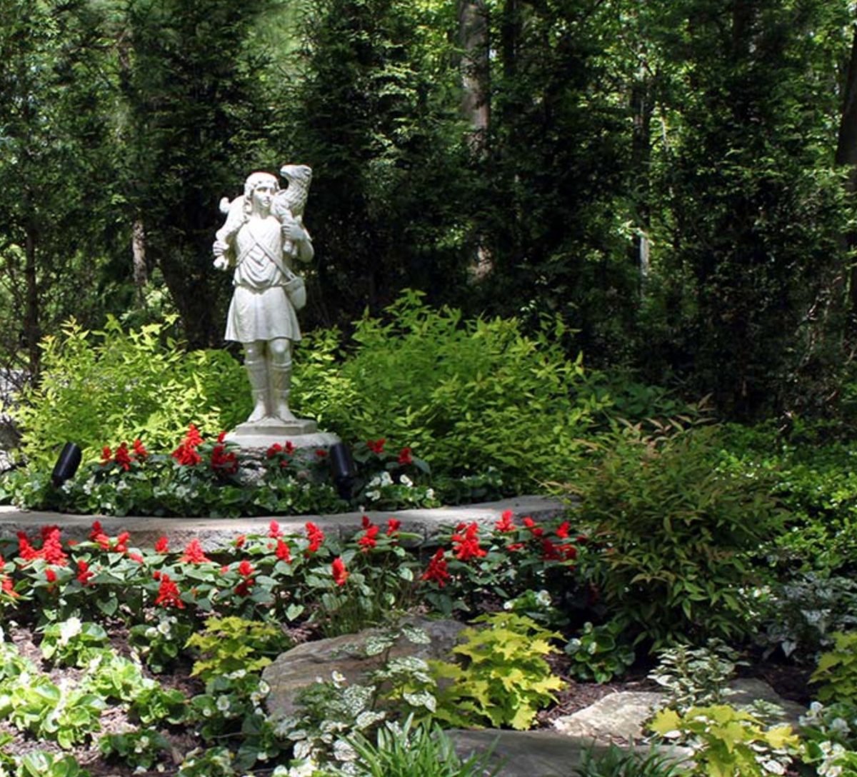 The Good Shepherd statue among the gardens at Malvern